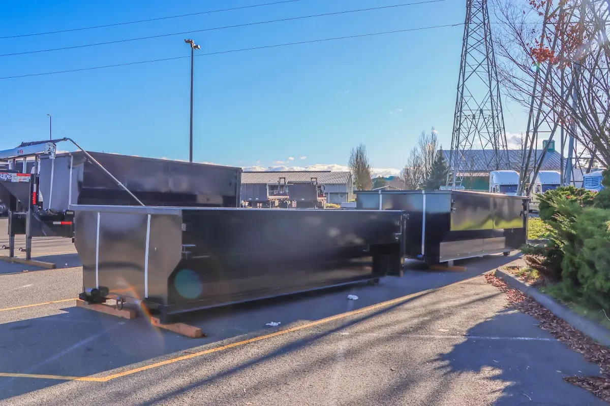 Roll-off dumpster ready for waste disposal at job site for Demolition Dumpster Rental in Maine